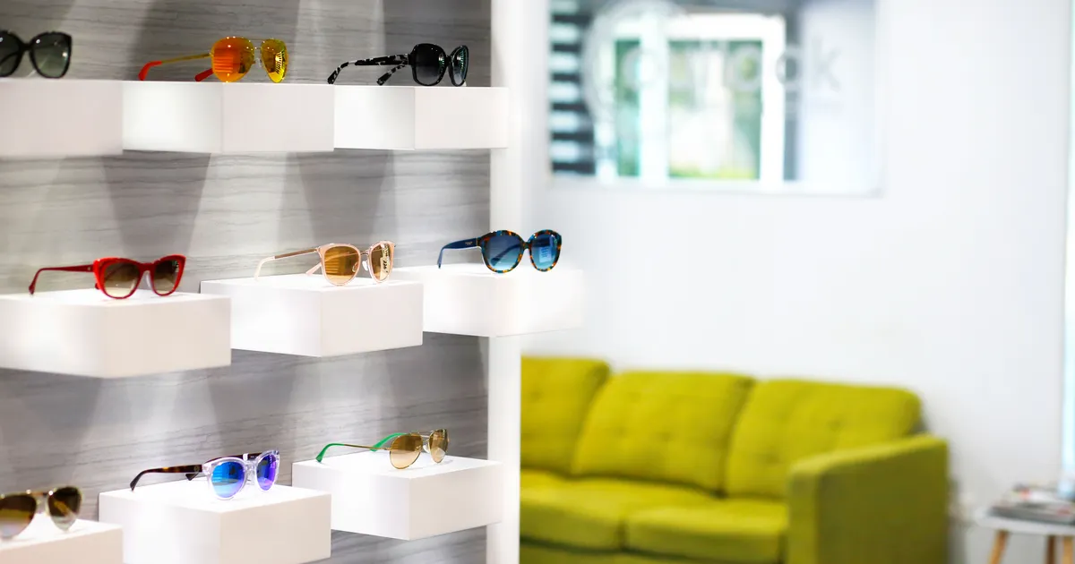 A display of sunglasses on the showroom wall at Outlook Eye Centre